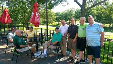 Donnie Lyons with his son and amateurs at George Wright GC